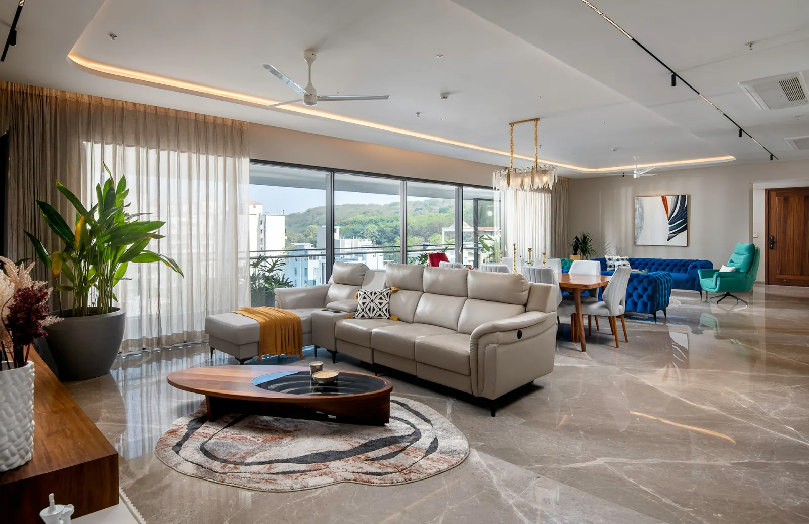 The living room, with lounge seating opening to the dining area beyond