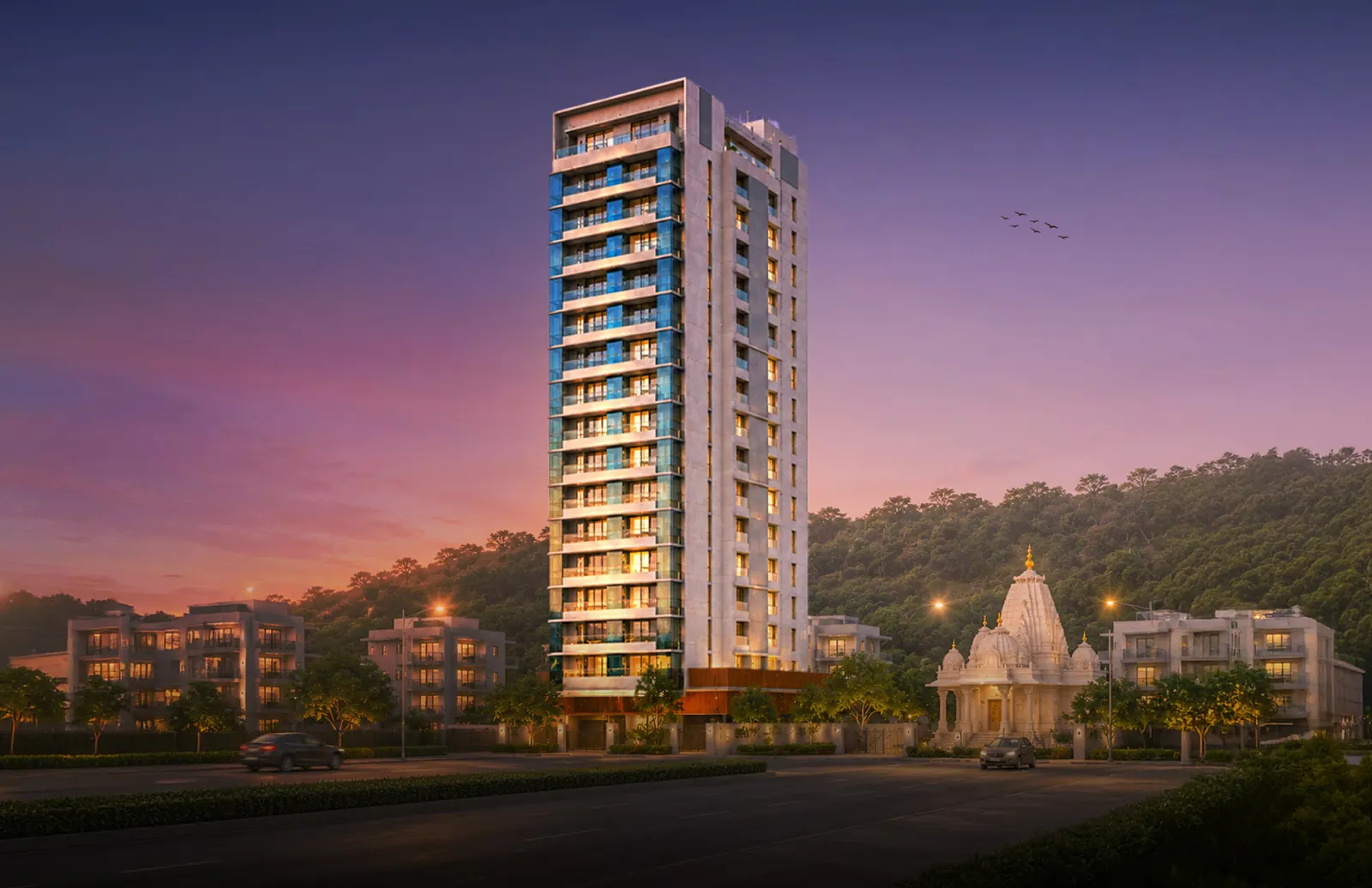 The Attalika tower lit at dusk beside the Shree Vardhamanpura Jain temple